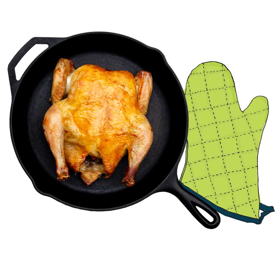 roast chicken in skillet with ovenmit