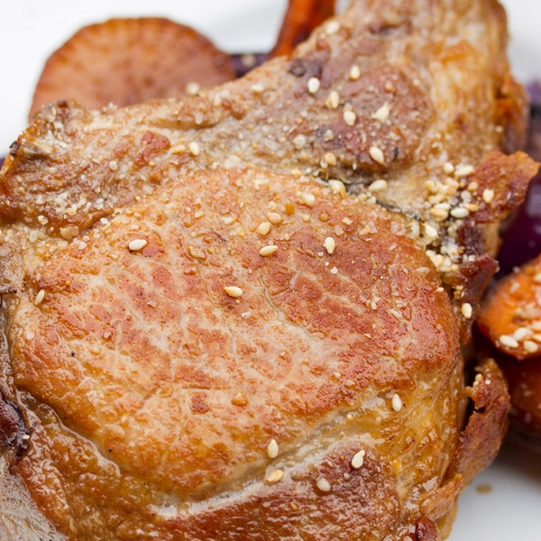 Whole, cooked Kurobuta pork rib chop, sesame seeds & salt