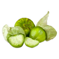 whole and halved green tomatillos, some with paper husks attached