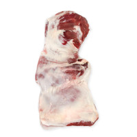 Raw boneless grass-fed lamb leg vertically on white background