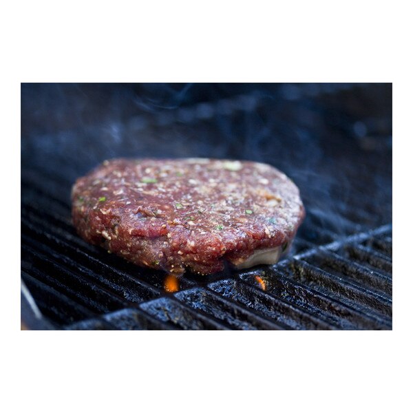 Kangaroo patty cooking on a barbecue grill