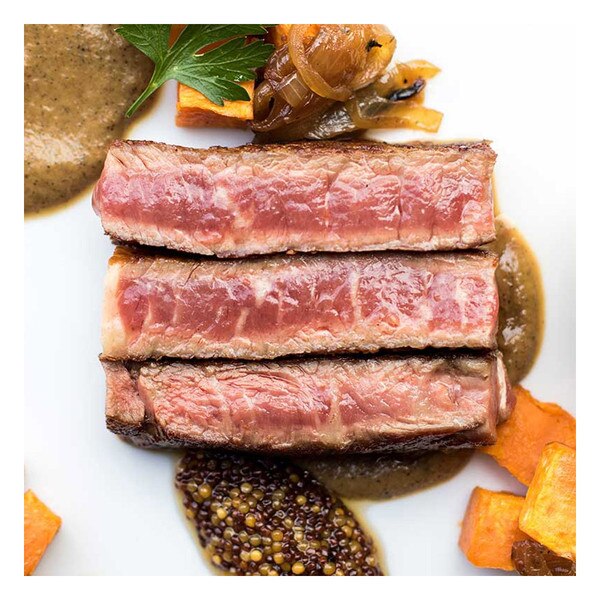 Cooked sliced Wagyu Ribeye with pickled mustard seeds, charred onion puree & sweet potato