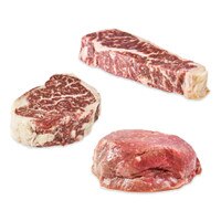 Raw strip steak, ribeye, and filet mignon from Wagyu Beef Sampler