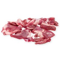 Raw pieces of grass-fed lamb trim on a white background