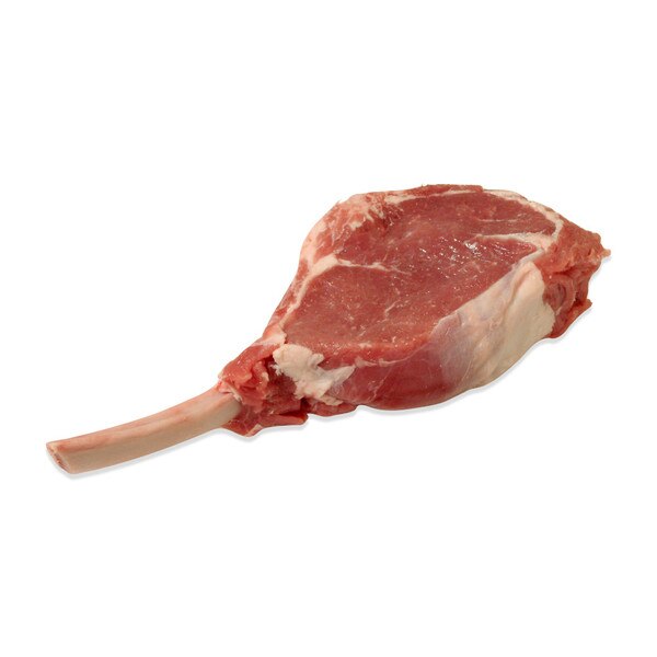 Raw grain-fed veal frenched rib chop on white background