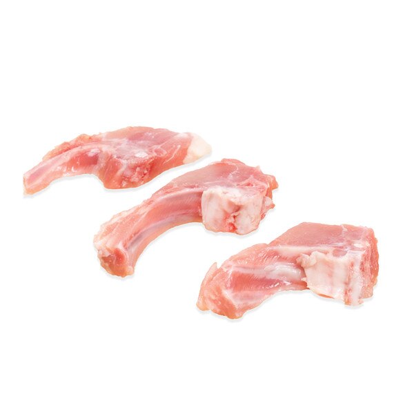 3 raw rabbit rib chops on white background