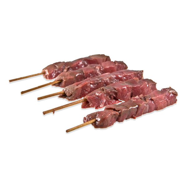 5 skewers of raw venison chunks on white background