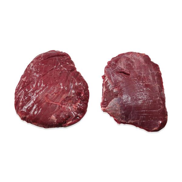 2 raw bison flank steaks on white background