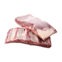 2 raw overlapping bison short ribs on a white background