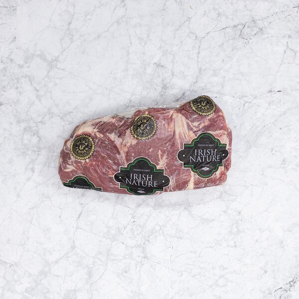 One vacuum-sealed package of raw oyster steaks with the Irish Nature label on a white marble background.