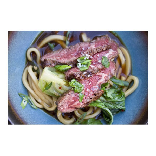 Noodles & grass-fed beef hanger steak in a gingery, umami-rich warming broth cut with cilantro and spicy chile flakes