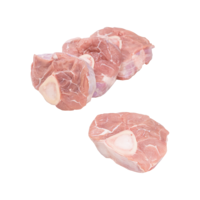 Four raw milk-fed French veal hindshanks crosscut for osso bucco on a white background, three leaning against each other, one alone in the foreground.