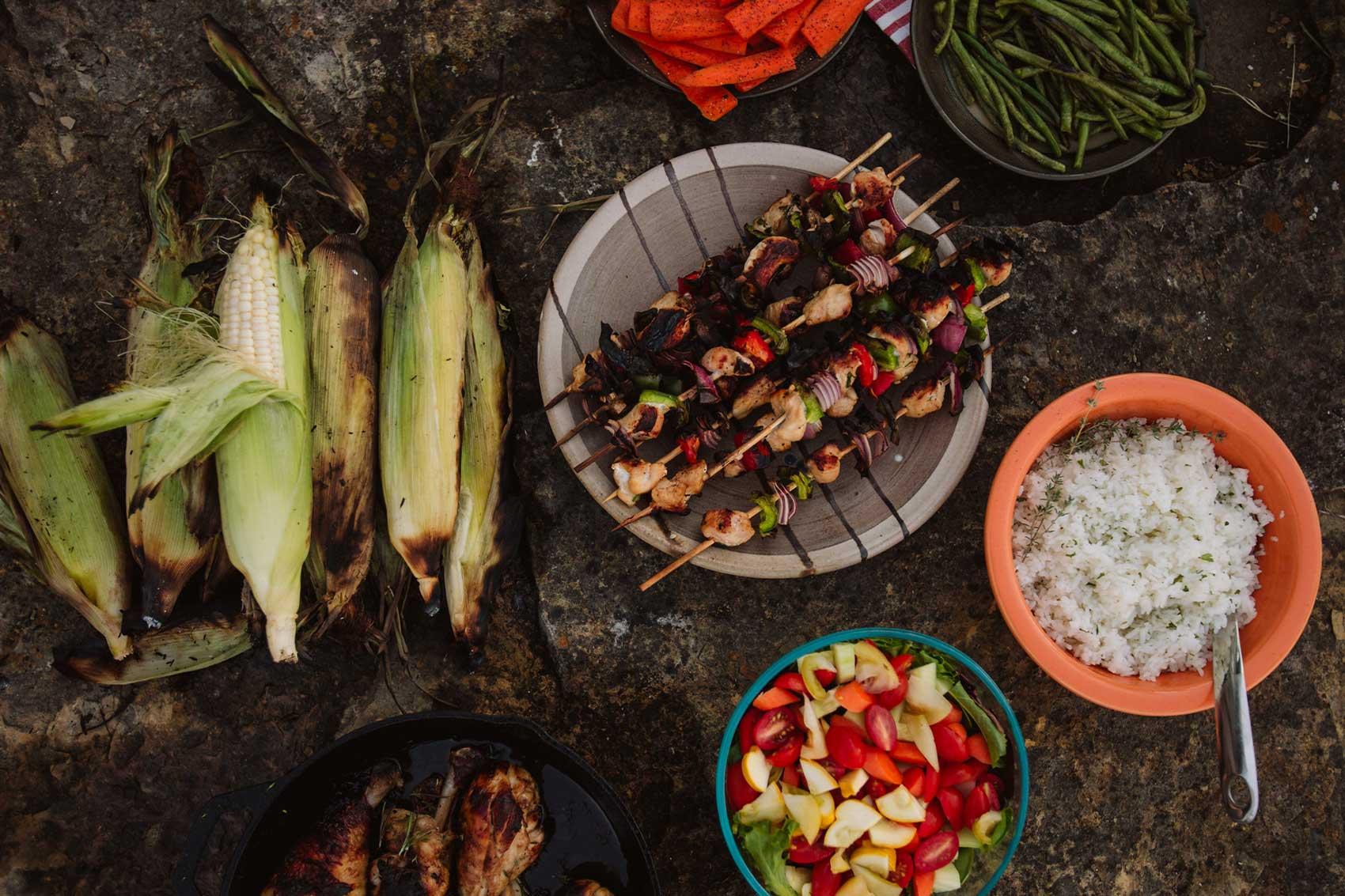 cooked kebabs and corn with rice