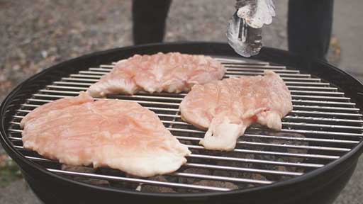 grilling chicken on grill