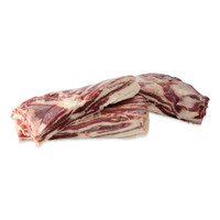 3 raw wild boar bellies, stacked, on white background